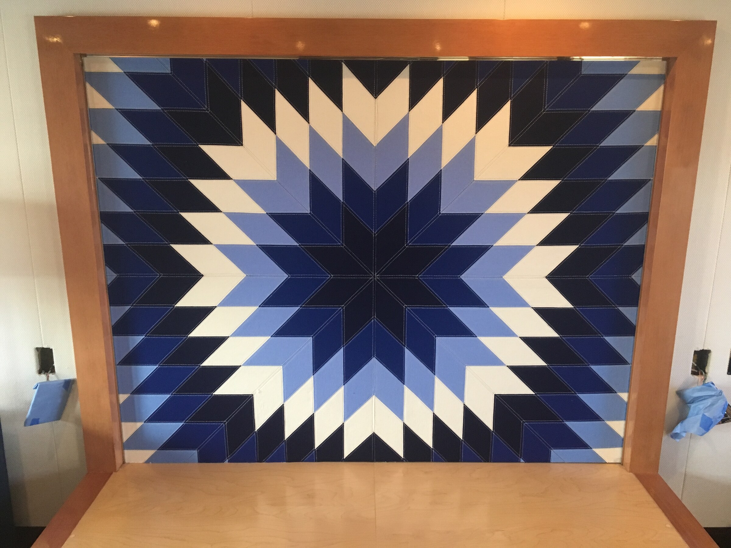 Blue and white marquetry starburst panel